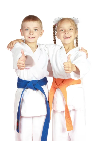 Muy feliz chico y chica atletas en karategi — Foto de Stock