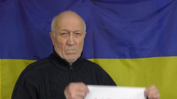 Elderly Man Stands Background Ukrainian Flag Raises Fly Zone Sign — Stock Video