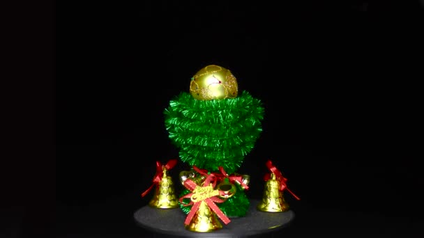 Candles Bells Golden Christmas Ball Rotates Green Decorated Stand — Video Stock