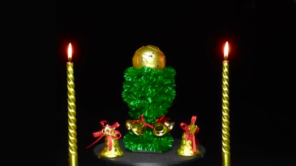 Candles Bells Golden Christmas Ball Rotates Green Decorated Stand — Stockvideo