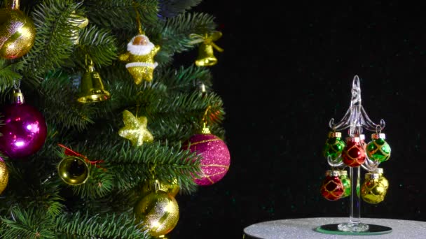 Black Background Small Christmas Tree Rotates Beautiful Decorated Christmas Tree — Stockvideo
