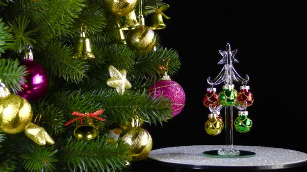 Black Background Small Christmas Tree Rotates Beautiful Decorated Christmas Tree — Video Stock