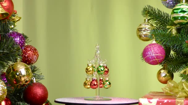 Yellow Background Small Christmas Tree Rotates Large Christmas Trees Decorated — Stockvideo