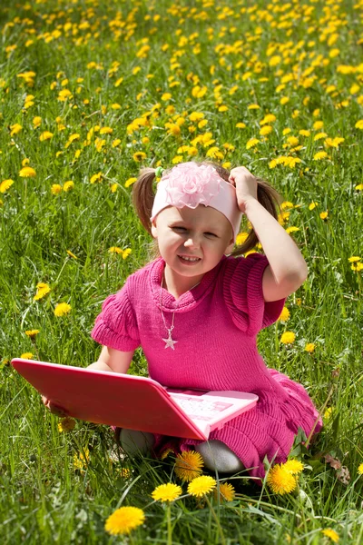 Girl with toy laptop — Stock Photo, Image