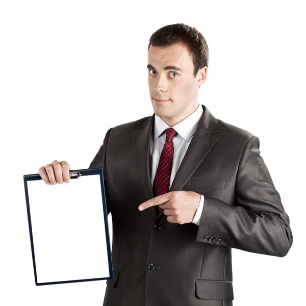 Businessman pointing finger at blank clipboard — Stock Photo, Image