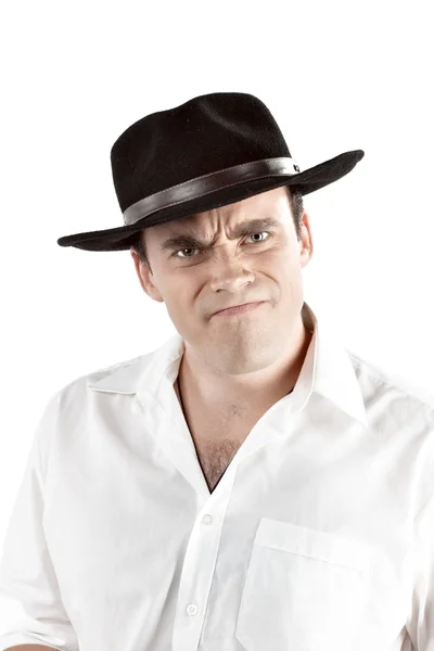 Portrait of angry young man in black hat. — Stock Photo, Image