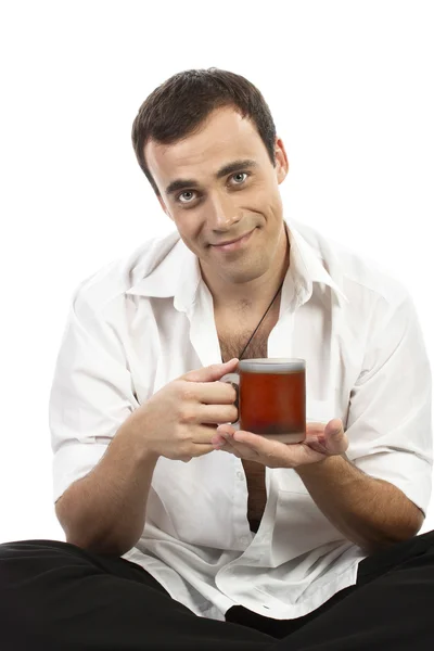 Happy young caucasian guy having a cup of tea — Stock Photo, Image