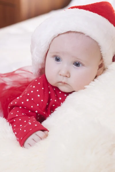 Cute Baby girl in christmas hat — Stock Photo, Image