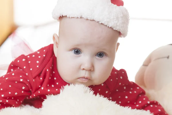 Cute Baby girl in christmas hat — Stock Photo, Image