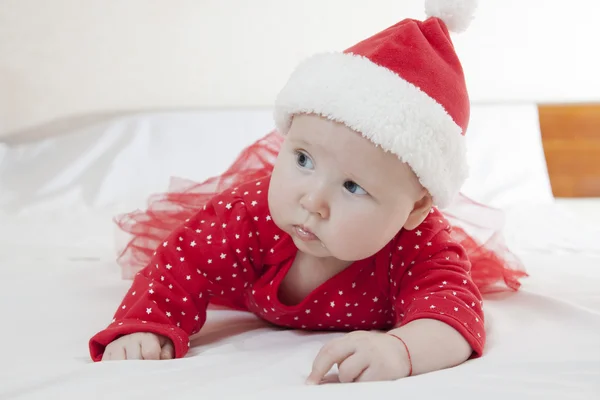 Cute Baby girl in christmas hat — Stock Photo, Image