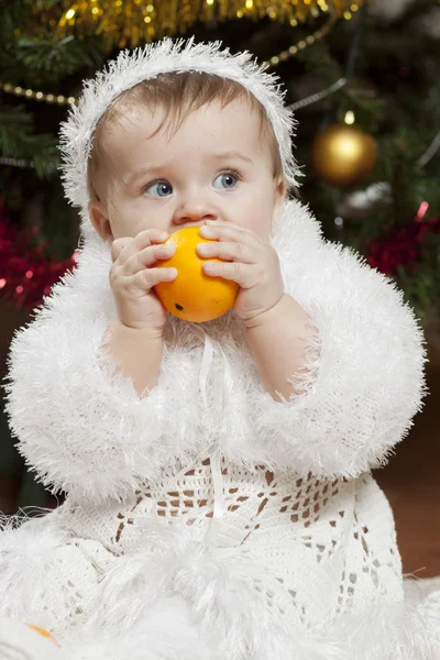 Happy little baby girl playing with fruits — Stock Photo, Image