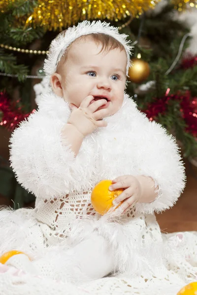 Happy little baby girl playing with fruits — Stock Photo, Image