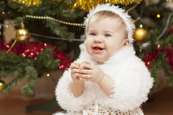 Happy little baby girl playing with fruits — Stock Photo, Image