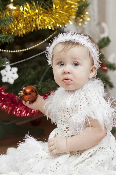 Happy little baby girl playing with fruits — Stock Photo, Image