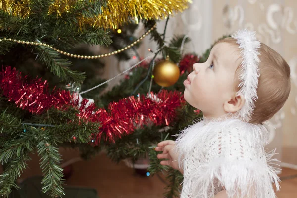 Happy little baby girl playing with fruits — Stock Photo, Image