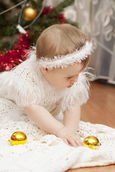 Happy little baby girl playing with fruits — Stock Photo, Image