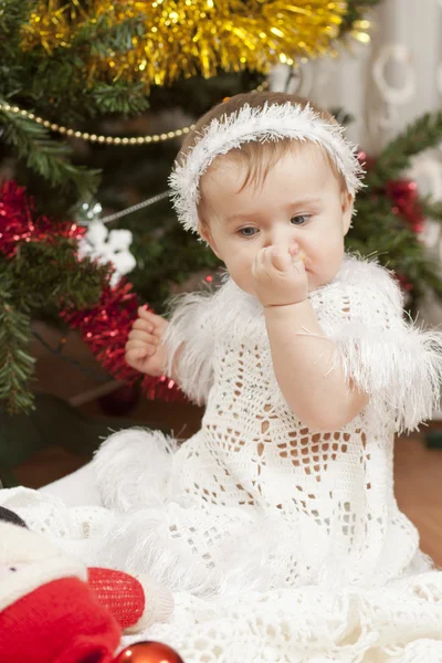 Happy little baby girl playing with fruits — Stock Photo, Image