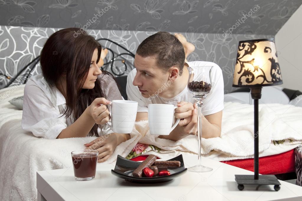 Breakfast on a table with couple lying