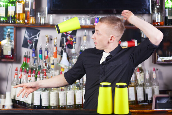 Professional barmen making cocktail
