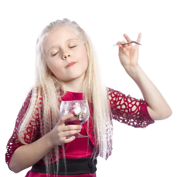 Happy beautiful girl enjoys eating dessert — Stock Photo, Image