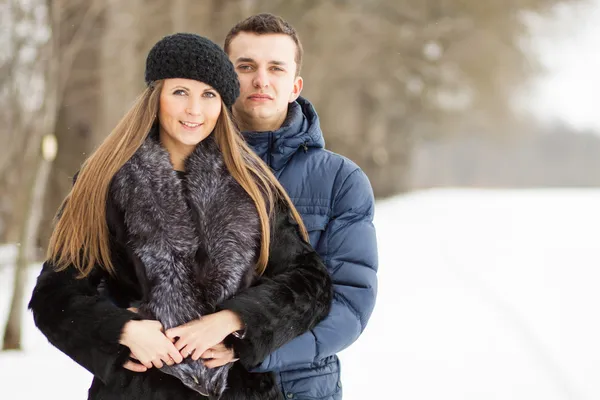 Happy Young Couple in Winter Park having fun — Stock Photo, Image