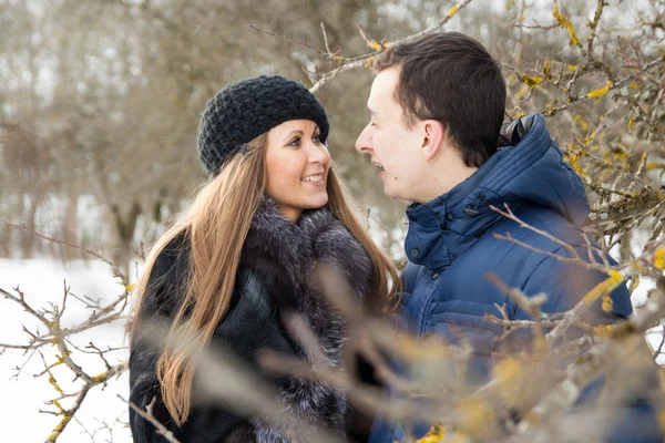 Happy Young Couple in Winter garden — Stock Photo, Image