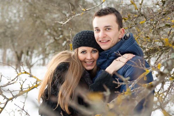 Happy Young Couple in Winter garden — Stock Photo, Image