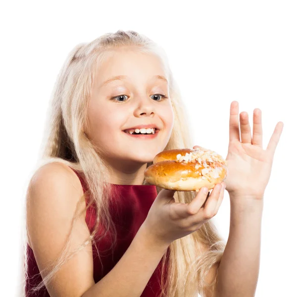 Girl looking at croissant — Stock Photo, Image