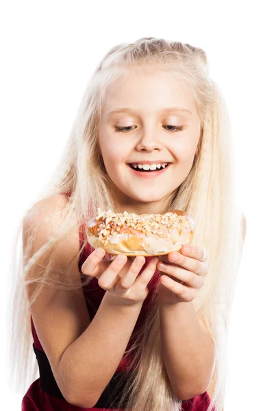 Girl looking at croissant — Stock Photo, Image