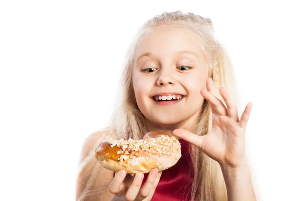 Girl looking at croissant — Stock Photo, Image