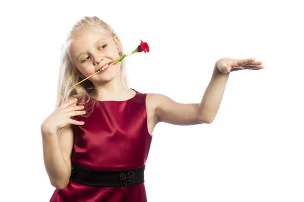 Beautiful blonde girl with rose in mouth — Stock Photo, Image