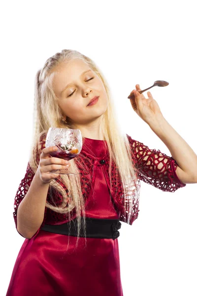 Beautiful blonde girl eating dessert — Stock Photo, Image