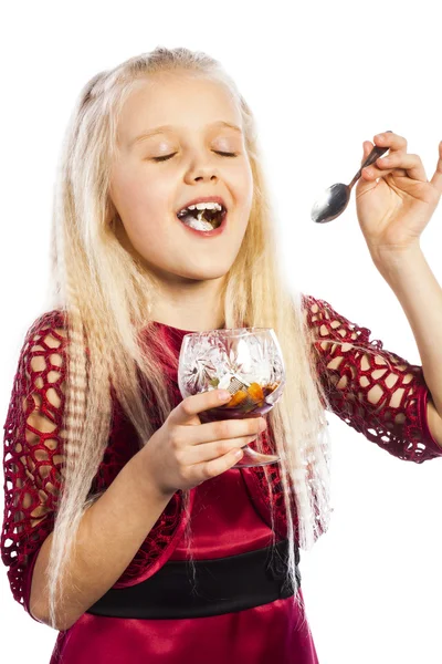 Beautiful blonde girl eating dessert — Stock Photo, Image