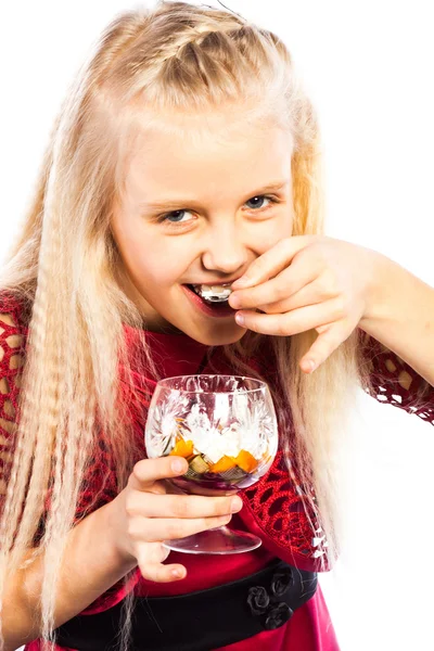 Beautiful blonde girl eating dessert — Stock Photo, Image