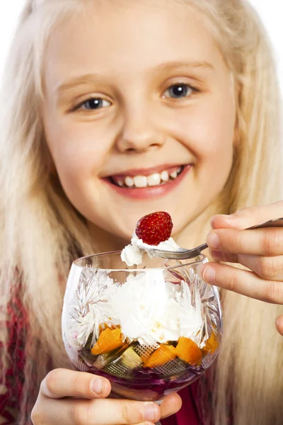 Beautiful blonde girl eating dessert — Stock Photo, Image
