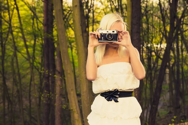 Beautiful adult girl with retro photo camera — Stock Photo, Image