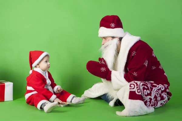 Father and son wearing Santa costume — Stock Photo, Image