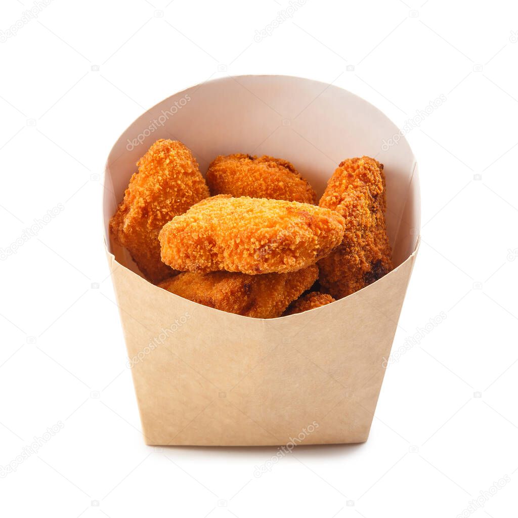 Box with tasty chicken nuggets isolated on white background.