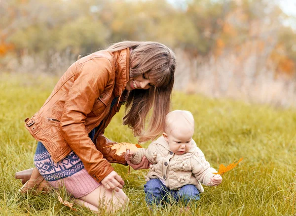 Happy family in autumn forest — Stock Photo, Image