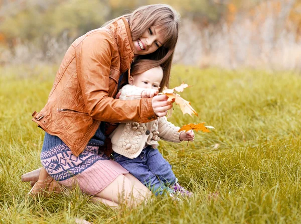 Happy family in autumn forest — Stock Photo, Image