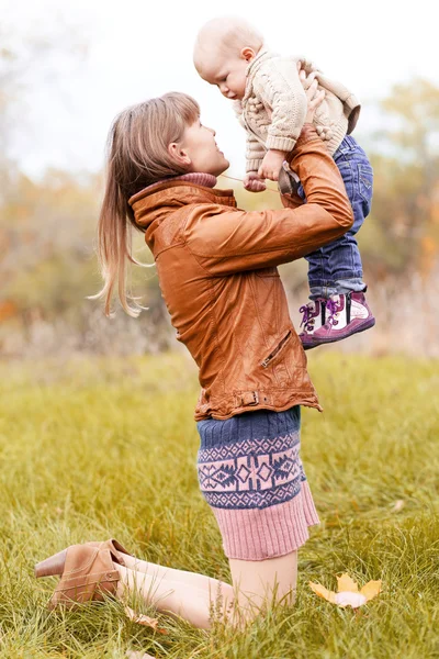 Happy family in autumn forest — Stock Photo, Image