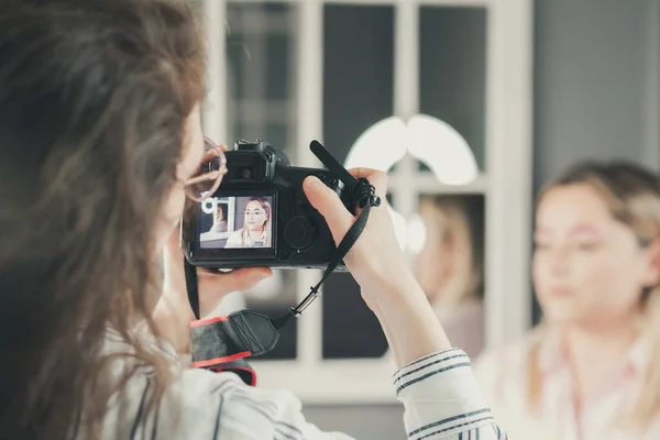 Woman shooting visual content for a beauty blogger
