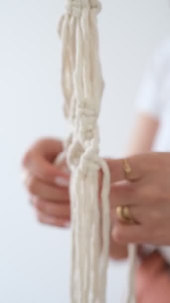 Woman weaving macrame flower pot handmade indoors — Stock Video
