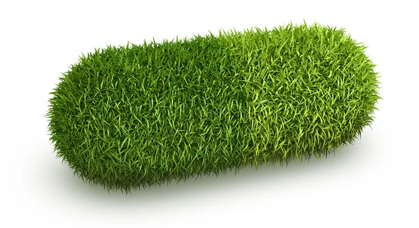 Kapsel mit grünen Graspillen — Stockfoto