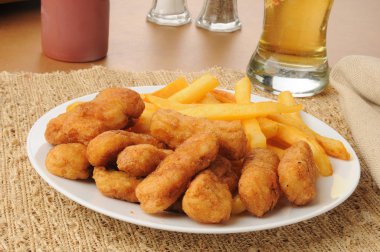 Honey battered chicken strips with beer clipart