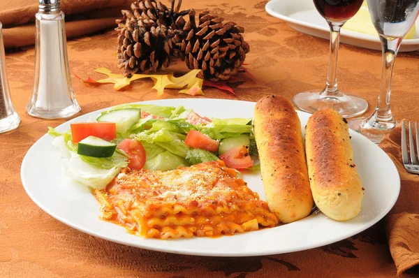 Lasagna on a Thanksgiving dinner table — Stock Photo, Image