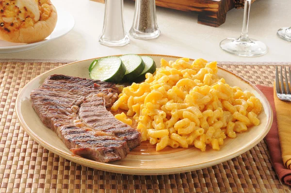 steak with macaroni and cheese