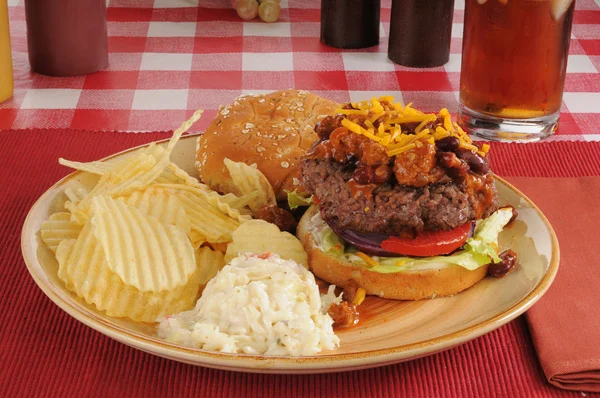 Chili cheeseburger with chips and coleslaw — Stock Photo, Image