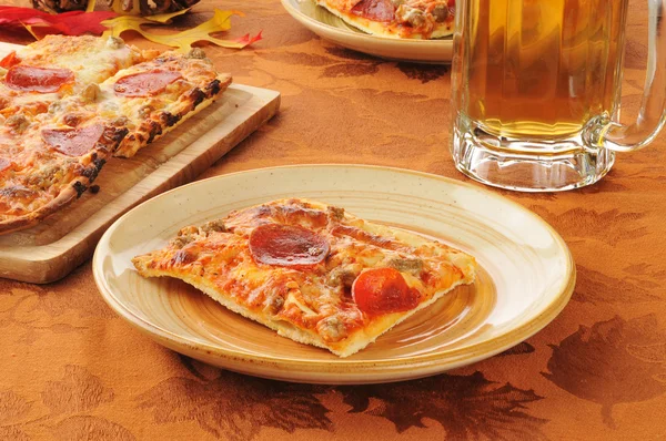 Pepperoni pizza and beer — Stock Photo, Image