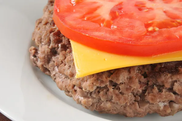 Hamburger with cheese and tomato — Stock Photo, Image